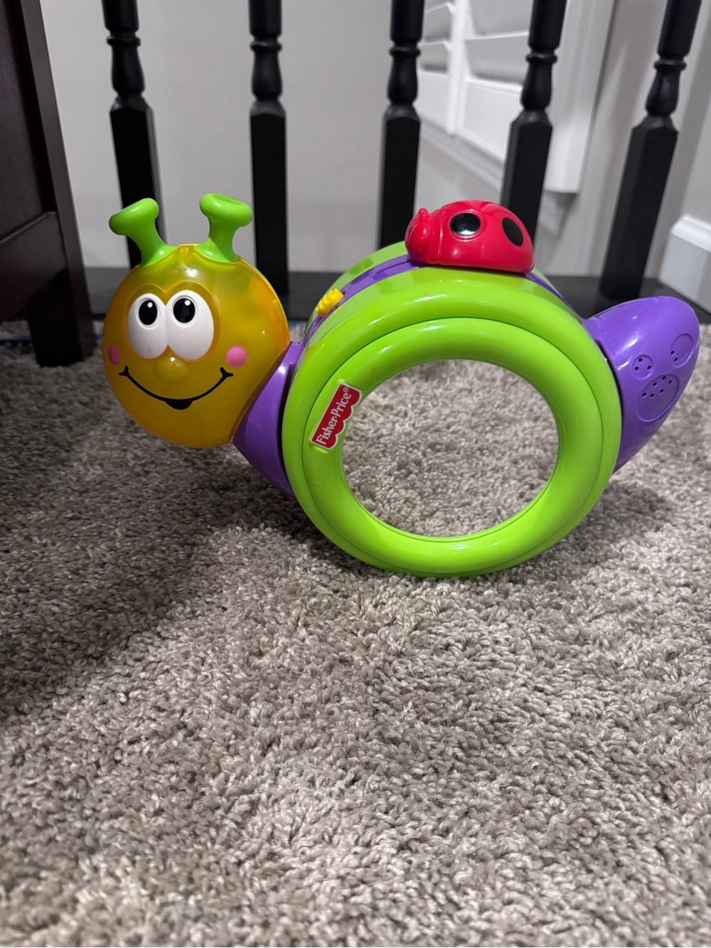 Fisher-Price Bright Green and Purple Snail Ring with Red Ladybug Accent